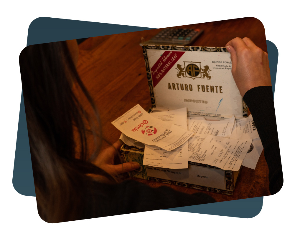 accountant looking through a box of receipts